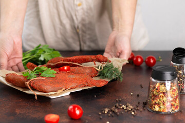 Dried white poultry meat with herbs, tomatoes and spices. The concept of home cooking healthy food. Close-up. Space for text