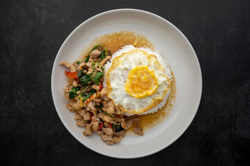Khao Pad Kra Pao Gai Kai Dao, Thai food, streamed rice topped with basil stir fried chicken and fried egg