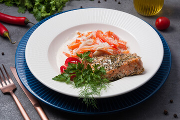 salmon with spices, baked with vegetables in cream