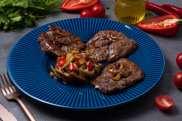 beef chops with vegetables and caramelized onions