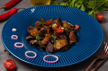 fried beef slices with porcini mushrooms and potatoes