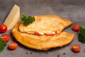 cheburek with alternative filling: cheese and tomatoes