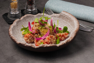 a quinoa salad with tomatoes and avocado. healthy diet