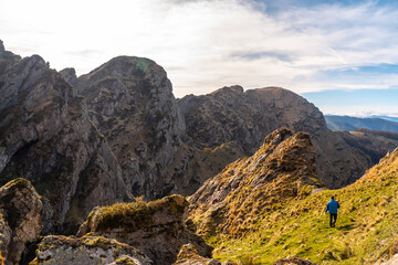 A young man walking on the top of the mountain of Aiako Harria or Peñas de Aya in the town of Oiartzun, Guipúzcoa. Basque Country