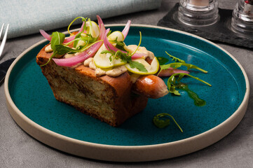 hot dog in a restaurant-alternative serving: homemade sausage in a brioche bun