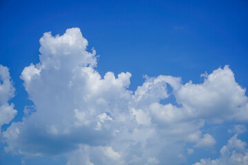 Naklejka na ściany i meble blue sky background with clouds. Beautiful white clouds against the blue sky.