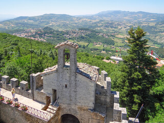 Fototapeta na wymiar View from the fortress La Chesta to the foothills of the Apennines. Region of Emilia-Romagna. Republic of San Marino