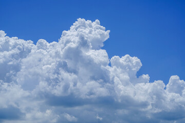 Naklejka premium blue sky background with clouds. Beautiful white clouds against the blue sky.