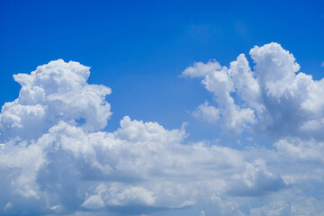 Naklejka na ściany i meble blue sky background with clouds. Beautiful white clouds against the blue sky.