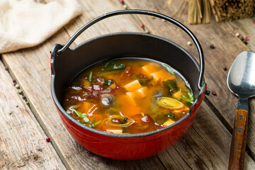 miso soup on bowl on old wooden table