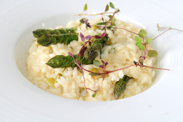 Asparagus risotto on a white plate