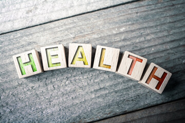 Curved Health Written On Wooden Blocks On A Board