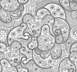 Beautiful abstract vector seamless pattern with handwritten curling lines, doodles and flowers