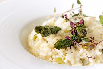 Asparagus risotto on a white plate
