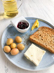 healthy breakfast and a glass of green tea on a wooden table