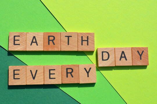 Naklejki Earth Day, Every Day, words isolated on green background