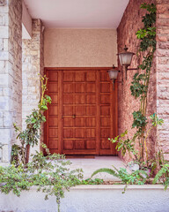 Fototapeta na wymiar elegant classic house front natural wood door, Athens Greece