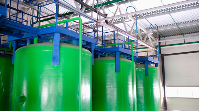 Green chemical tanks, huge barrels of chemicals, polyol containers