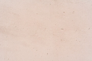 Rough pink wall. Close up view