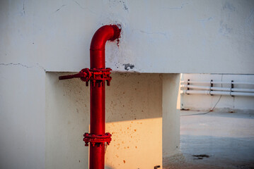 Red pipe of Fire Fighting systems is supplying water to the water sprinkler or private fire...