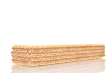 One sweet vanilla waffle, close-up, isolated on white.