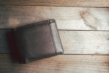 Brown Leather Wallet On A Wooden Board With Copy Space