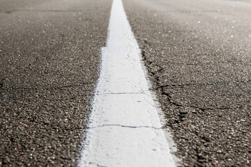 Old asphalt road. Driving on an empty road
