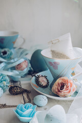 teacups with flowers and other decor