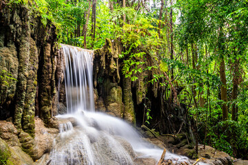 Waterfall and blue emerald water color in Erawan national park. Erawan Waterfall, Beautiful nature rock waterfall steps in tropical rainforest at Kanchanaburi province, Thailand