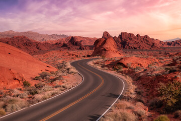 Valley of Fire State Park, Nevada, United States. Scenic road in the desert during a cloudy morning. Dramatic Sunrise Sky Art Render.