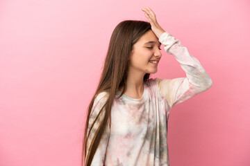 Fototapeta premium Little girl over isolated pink background has realized something and intending the solution