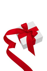 White gift box with red bow and spiral satin ribbon isolated on white background.	