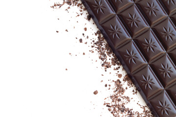 Isolated dark chocolate bar with shavings top view