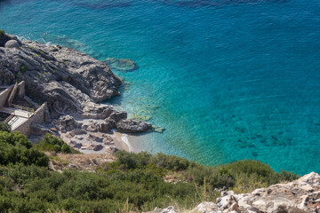 Small beach among rocks and turquoise sea, Albania. Travel and vacation theme, beautiful nature