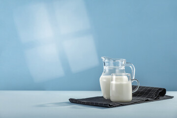 Fresh milk and blue background with shadow 