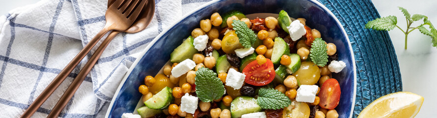 Top down narrow view of a mediterranean salad ready for serving.