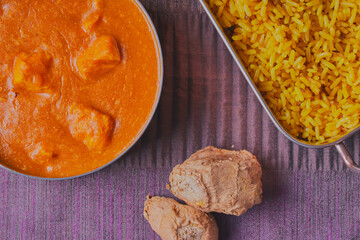 Flat-lay of chicken curry and rice.
