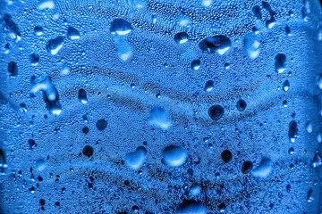 Close up of a sparkling water bubbles bottle with wavy lines