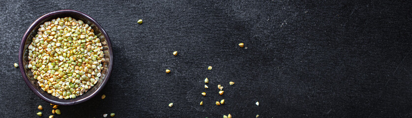 green buckwheat raw grain on the table wholesome food healthy food meal snack copy space food background rustic. top view keto or paleo diet vegan or vegetarian food