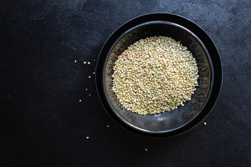 green buckwheat raw grain on the table wholesome food healthy food meal snack copy space food background rustic. top view keto or paleo diet vegan or vegetarian food