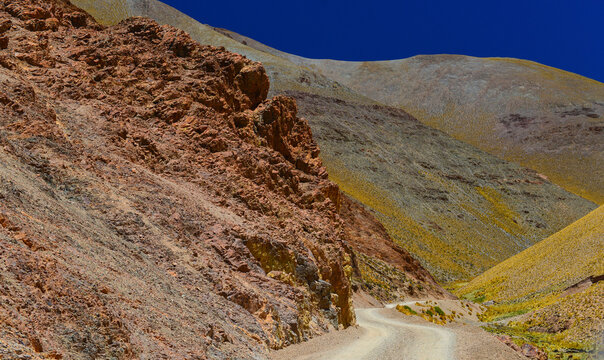 Rough and colorful road on the way from La Poma to the Abra del Acay mountain pass (4.972m), the highest point in Argentina's National Route 40 (RN40), Salta, northwest Argentina