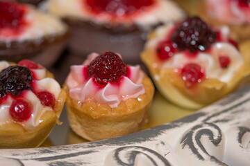  cream cakes with  fruit 