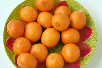 Tangerines on wooden plate