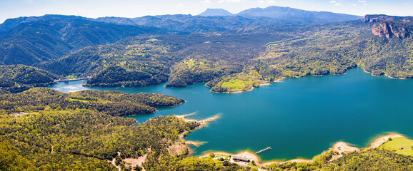 Fototapeta na wymiar Great aerial panorama of the Sau reservoir in the area of the dam, seen from the cliffs of Tavertet. Tavertet. Collsacabra, Osona, Catalonia, Spain