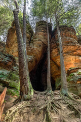 21 Horse Cave, also know as Chapel Cave, is a large sandstone recess cavern in the woods Hocking Hills State Park, Ohio.
