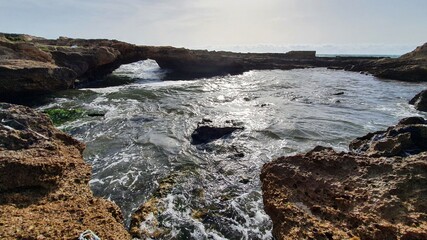 Waves crashing on rocks. Salt production. Discover the world. Heavy wind at the beach. Place to relax and enjoy tanning. Vacations in Lebanon. Sunset view
