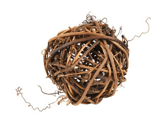 Dry brown rattan ball with twisted tendrils isolated