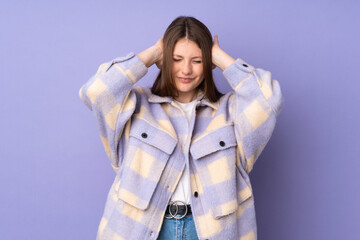 Teenager caucasian girl isolated on purple background frustrated and covering ears