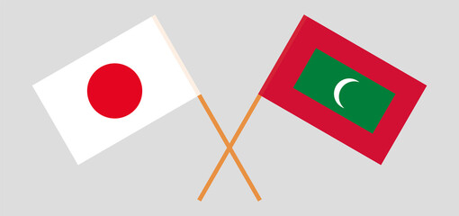 Crossed flags of Japan and Maldives. Official colors. Correct proportion