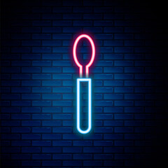 Glowing neon line Spoon icon isolated on brick wall background. Cooking utensil. Cutlery sign. Colorful outline concept. Vector